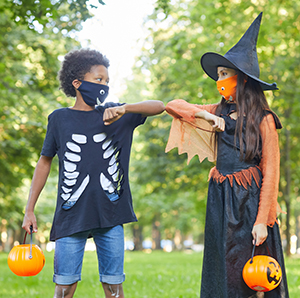 Halloween 2020 two friends getting ready to trick-or-treat