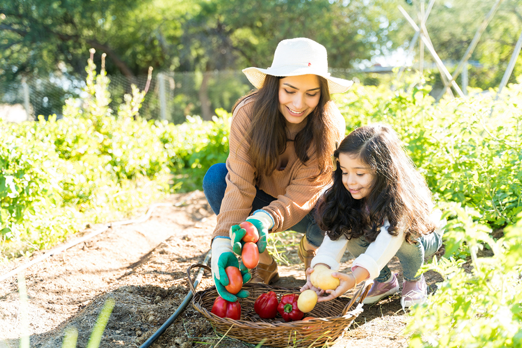 Image of mother and daughter gardening